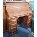 An Edwardian Roll Top Kneehole Desk with Fitted Interior and Four Drawers Either Side Kneehole,