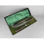 A Cased Three Piece Carving Set with Antler Handles