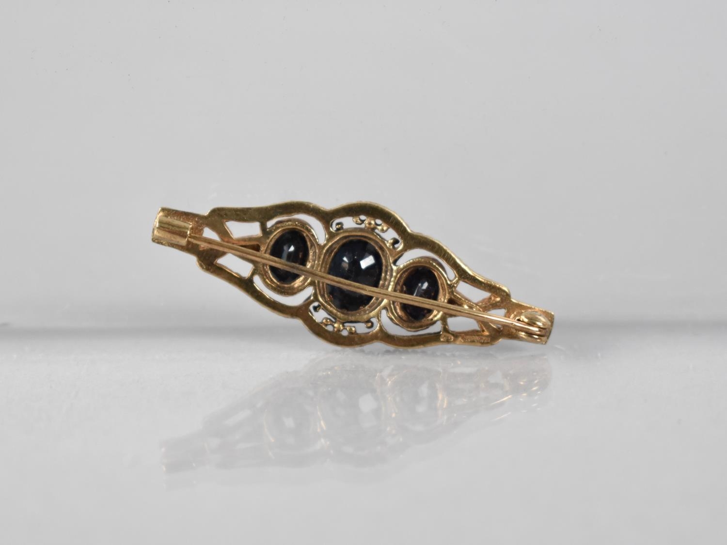 A 9ct Gold and Sapphire Brooch, Central Oval Cut Stone Measuring 7.9x6.1mm, Raised in Ten Claws to a - Image 2 of 2