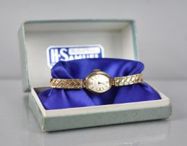 A 9ct Gold Cased Ladies Everite Vintage Wristwatch, on unrelated Expanding Non-Gold Strap. Working