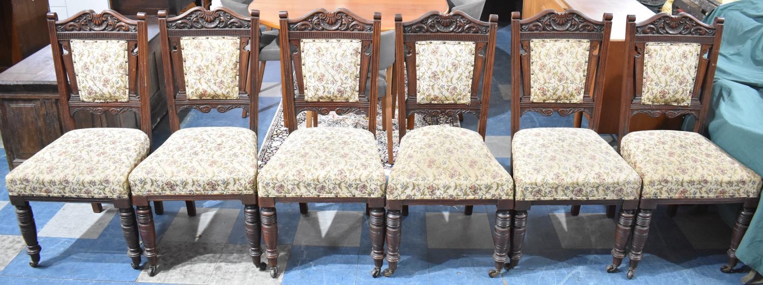 A Set of Six Edwardian Carved Mahogany Framed Dining Chairs with Tapestry Seats and Back Panels