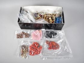 A Large Collection of Various Loose and Strung Beads Etc