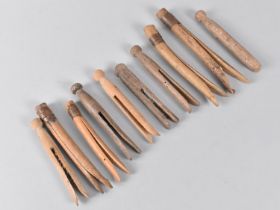 A Collection of Various Vintage Wooden Gypsy Pegs