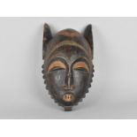A Hand Carved African Tribal Mask, 38cms High