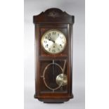 An Edwardian Oak Westminster Chime Wall Clock