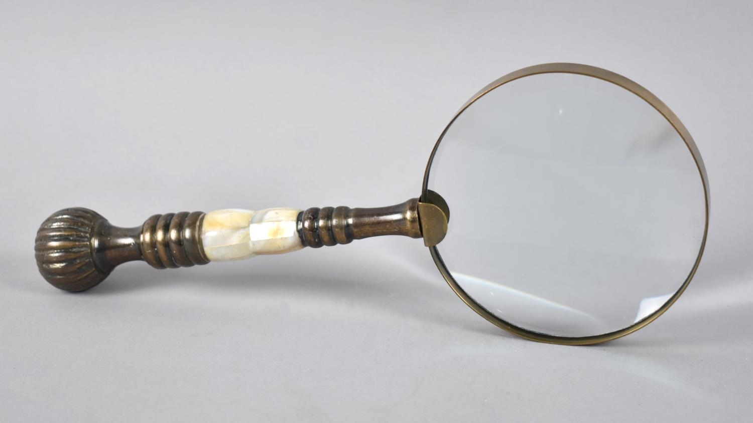 A Modern Brass and Mother of Pearl handled Desktop Magnifying Glass, 25.5cms Long