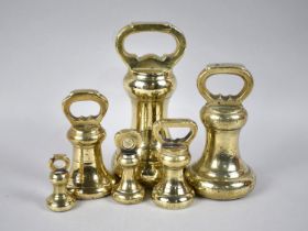 A Collection of Six Various Brass Bell Weights, Heaviest 7lbs