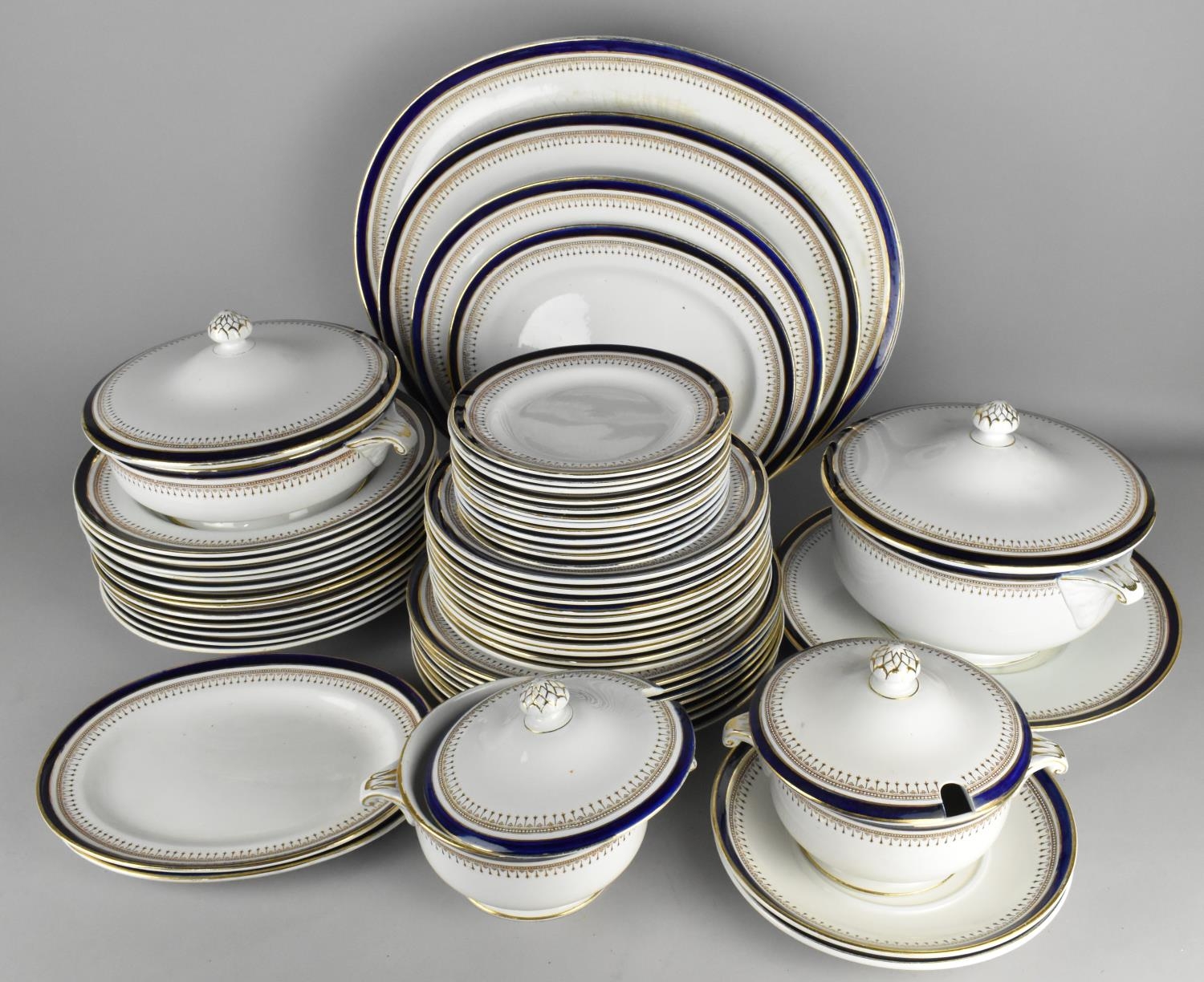 A Large Minton's Gilt and Blue Trim Dinner Service to Comprise Graduated Meat Plates, Plates,