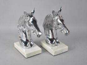 A Pair of Aluminium and Marble Horse Head Bookends, 23cms High