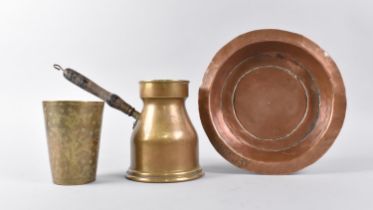 An Indian Circular Copper Bowl, an Engraved Beaker and a Side Pouring Brass Jug