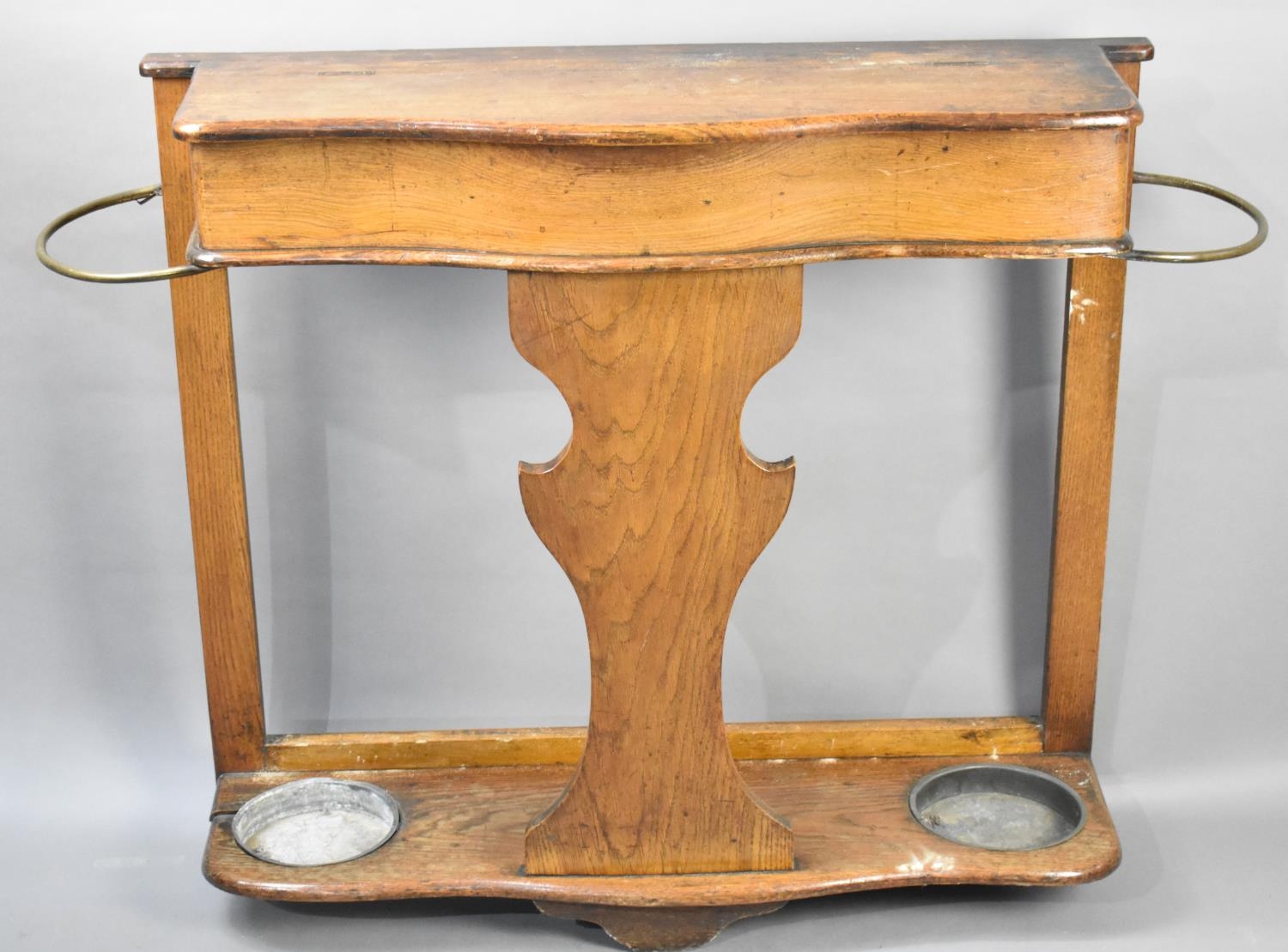 A Late 19th/Early 20th Century Oak Hall Stick Stand with Serpentine Front and Brass Hoops Either
