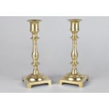 A Pair of Polished Brass Candlesticks on Square Bases, 19cms High