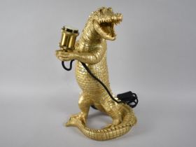 A Modern Novelty Table Lamp in the From of a Gilt Painted Standing Alligator, 39cms High