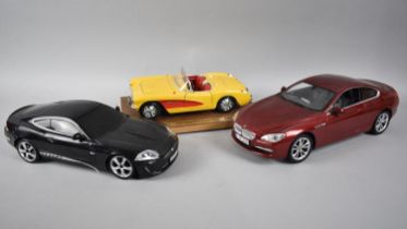 A Burago Chevrolet Corvette 1957, a BMW 650i and Battery Driven XKR