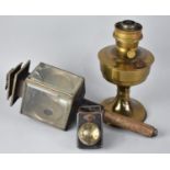 An Aladdin Brass Oil Lamp Base, a 19th Century Trap Lamp and a Vintage Bullseye Torch