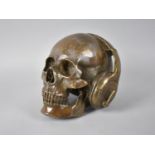 A Large and Heavy Modern Art Sculpture, Skull Wearing Headphones, 16.5cms High