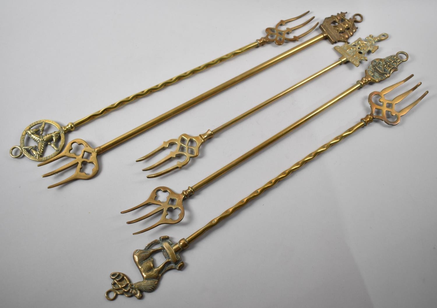 A Collection of Five Mid 20th Century Brass Toasting Forks
