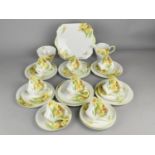 A Shelley Daffodil Pattern Tea Set (Pattern no. 13670) to Comprise Eight Cups, Nine Saucers, Six