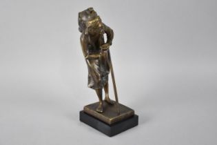 A Reproduction Bronze Study of Arabic Water Carrier with Stick and Cup, In the Manner of Bergmann,
