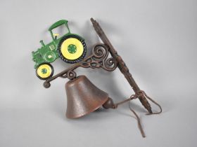 A Cold Painted Cast Metal Wall Mounting Bell with Tractor Motif