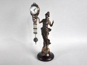 A Reproduction Bronze Mystery Clock in the Form of a Standing Art Nouveau Maiden, 33cms High,