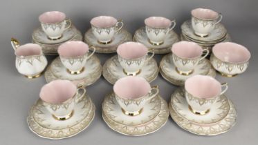 A Pink, White and Gilt Trim Decorated Tea Set to Comprise Ten Cups, Saucers, Side Plates, Milk Jug