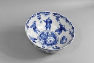 A Chinese Blue and White Bowl Decorated with Figures and Central Dragon Motif, 25cm diameter
