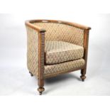 An Edwardian Oak Framed Tub Armchair