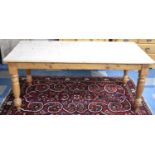 A Rectangular Pine Scrub Top Dining Table with Turned Supports, Somewhat Pet-Chewed, 182cms by 89cms