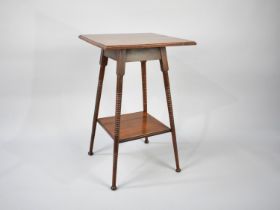 An Edwardian Mahogany Square Topped Occasional Table with Bobbin Supports and Stretcher Shelf, 44cms