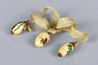 A Late 19th/Early 20th Century Set of Three Japanese Miniature Carved Bone Eggs Decorated with