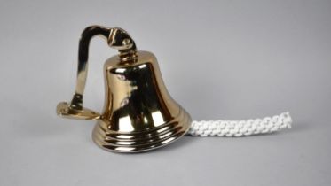 A Reproduction Brass Effect Wall Hanging Bell, 14cms Diameter and 16cms High, Plus VAT