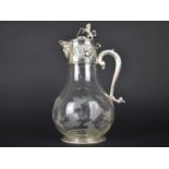 A Glass and Silver Plate Claret Jug, the Mount with Mask Head Lip, Floral Relief Decoration and