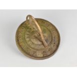 A Circular Cast Metal Sundial Top Decorated with Half Portraits of Sun and Moon, 19cms Diameter