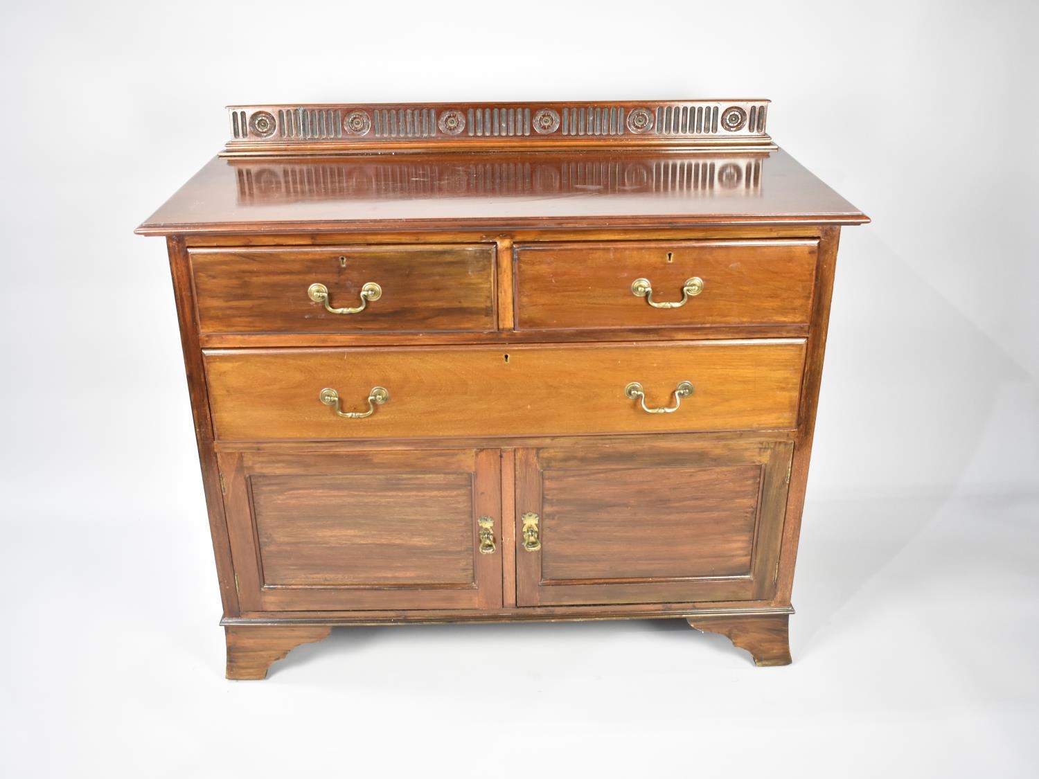 A Galleried Edwardian Mahogany Side Chest with Two Short and One Long Drawer over Cupboard Base,