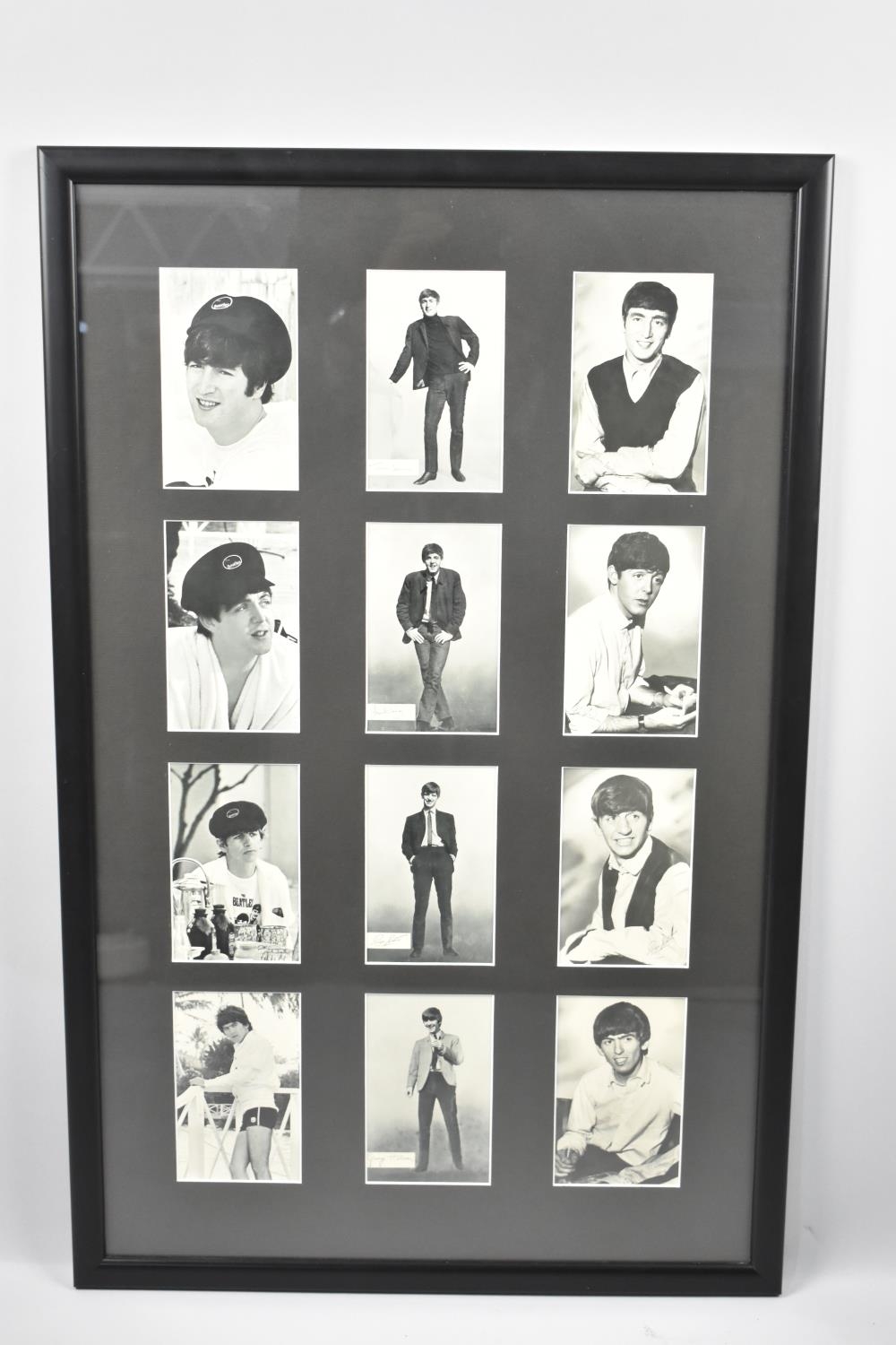 A Framed Set of Twelve Monochromed Beatles Cards, Framed 38x75cms