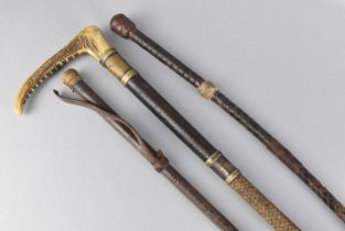 A Vintage Bone Handled Riding Crop and Two Leather Riding Whips, All with Condition issues