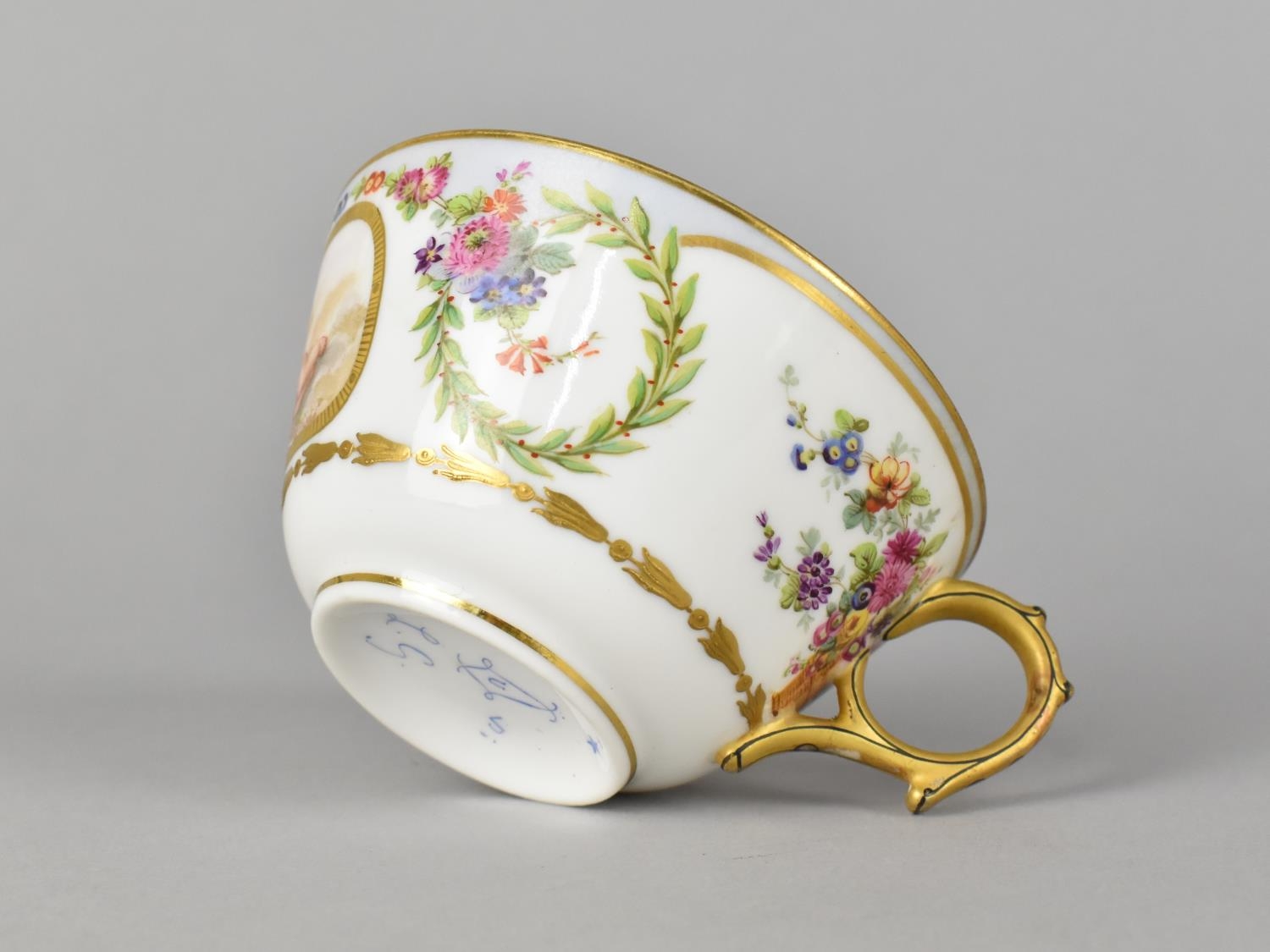 A Sevres Porcelain Cup Decorated with Cherub Cartouche with Gilt Detailing, Laurel Wreaths and