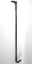 An Interesting 19th Century Ladies Riding Crop with Carved Handle and Leather Covered Shaft, 80cms