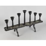 A Modern Heavy Cast Iron Seven Branch Candle Stand, 51cms Wide