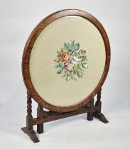 An Edwardian Circular Oak Swivel Table or Screen, Tapestry Centre, 68cms Diameter