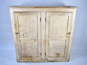 A Late 19th/Early 20th Century Pine Kitchen Larder Cupboard with panelled Doors to Shelved Interior,