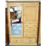 A Late Victorian/Edwardian Stripped Pine Combination Wardrobe with Mirrored Door to Hanging