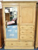 A Late Victorian/Edwardian Stripped Pine Combination Wardrobe with Mirrored Door to Hanging