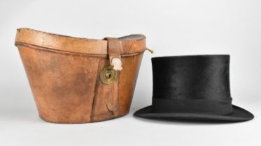 A Late 19th/Early 20th Century Top Hat in Leather Case, Internal Measurements 20cms by 16cms, Case