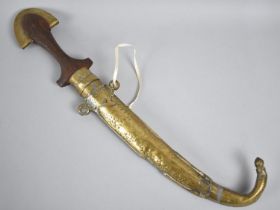 An Indian Curved Blade Dagger with Brass Mounted Wooden Handle and Scabbard, 41cms Long