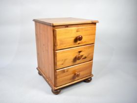 A Modern Pine Three Drawer Bedside Chest, 45cms Wide and 60cms High