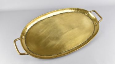 An Oval Brass Two Handled Tray, 44cms Wide