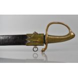 A French 1819 Pattern Briquet Short Sword having Ribbed Brass Grip and Slightly Curved Blade.