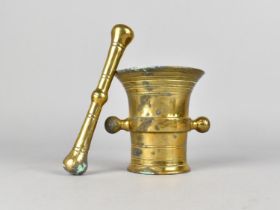 A Vintage Brass Pestle and Mortar, 9cms Diameter and 10cms High